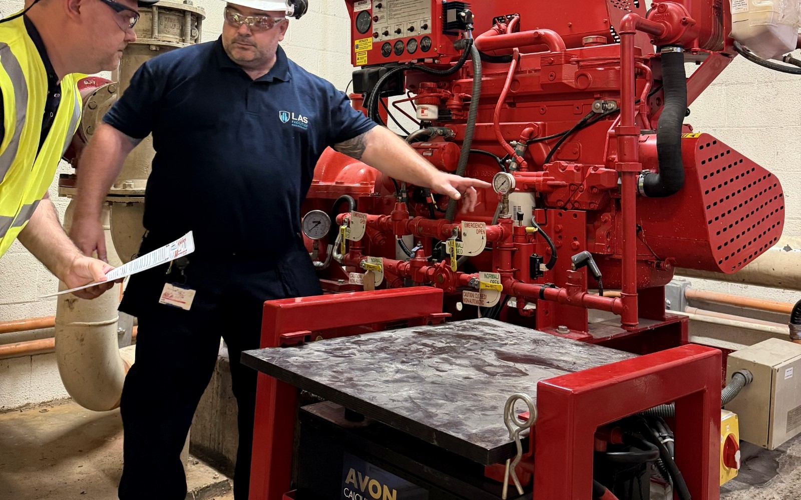 LAS reviewing a commercial sprinkler system with the site team